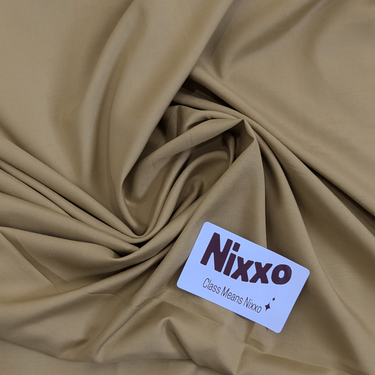 NIXXO label on beige fabric