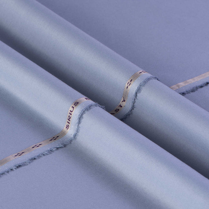 Close-up of rolled-up fabric with 'SIRIO' branding on a purple background