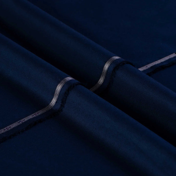 Navy fabric with a subtle pattern on a dark background